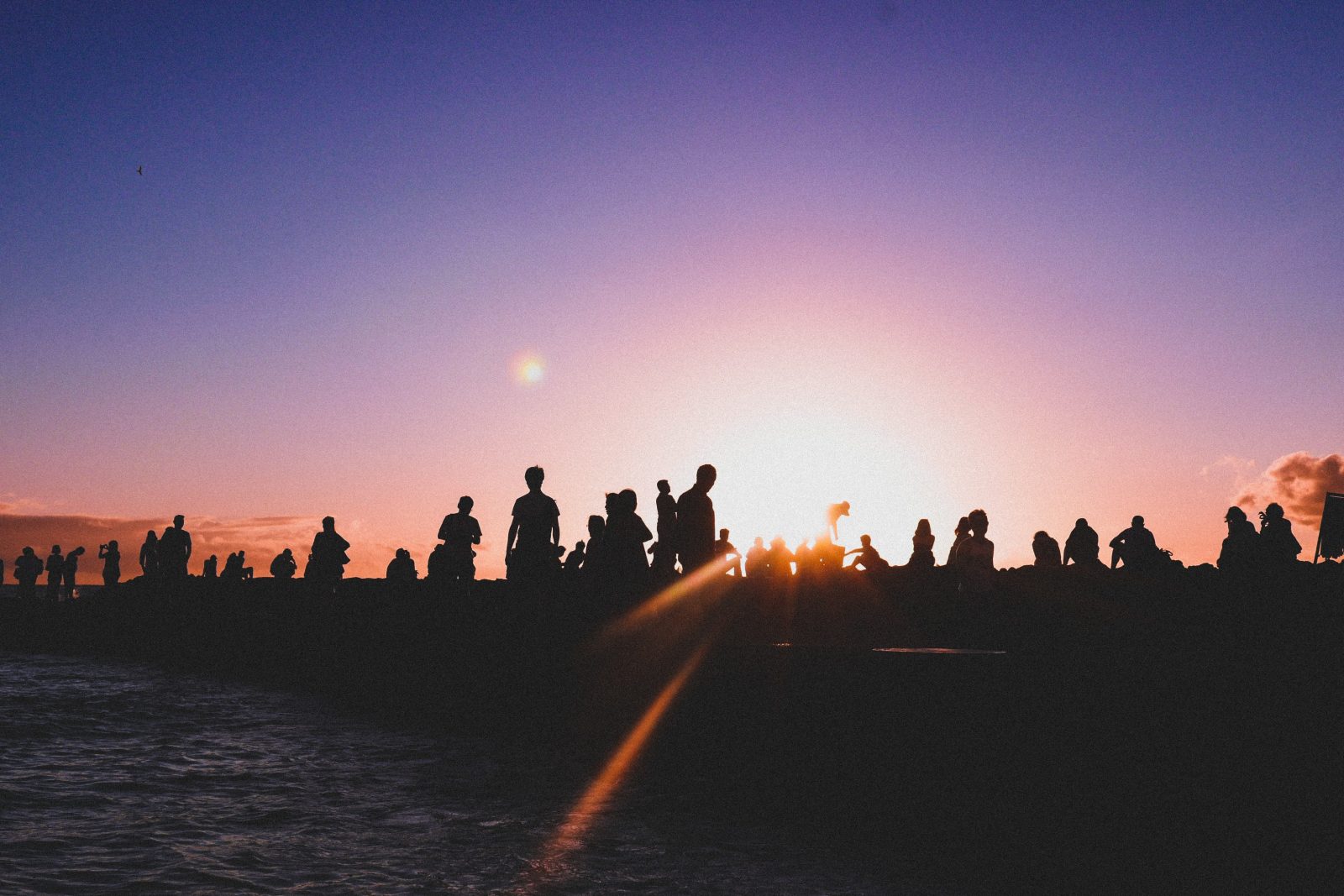 A crowd at sunset